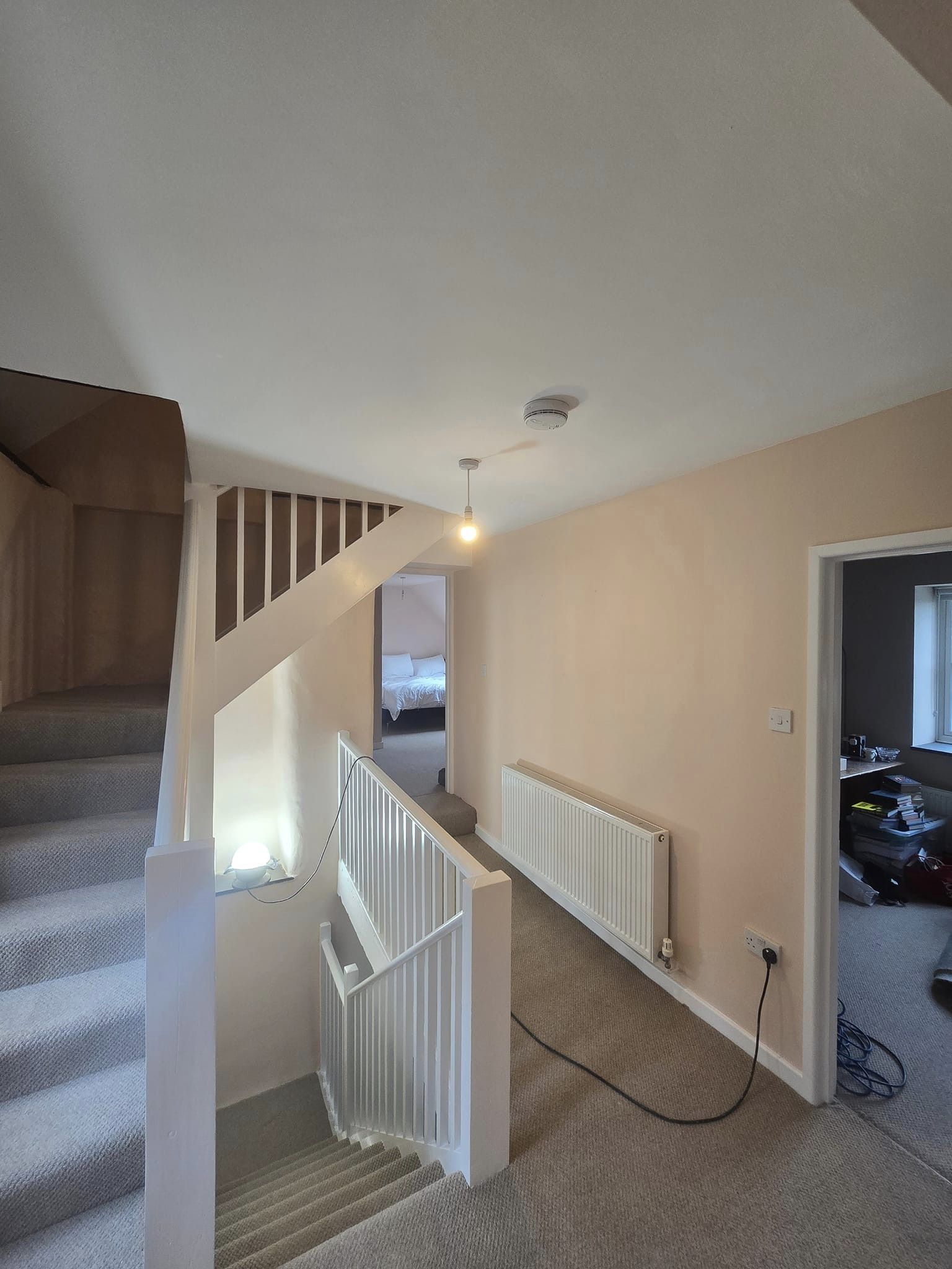 hallway carpeted and painted